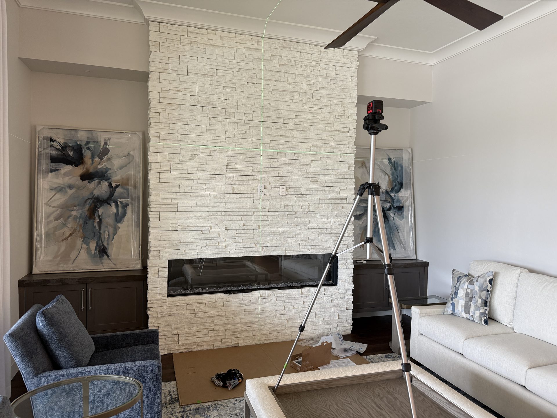Laser layout on the stone fireplace before the mount — Shadow Wood